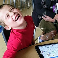 Child laughing at bubbles